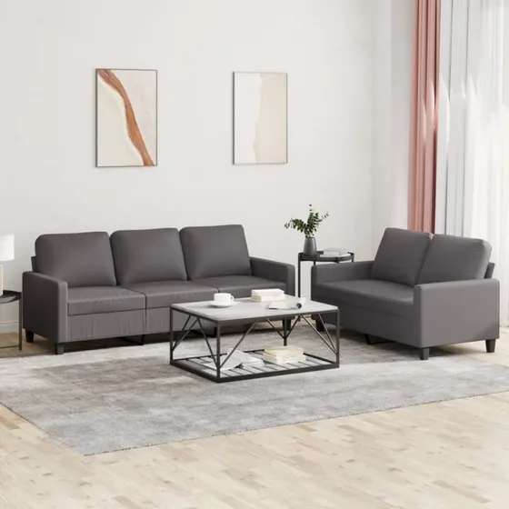 2-delers sofasæt med gråt kunstlæder og hynder