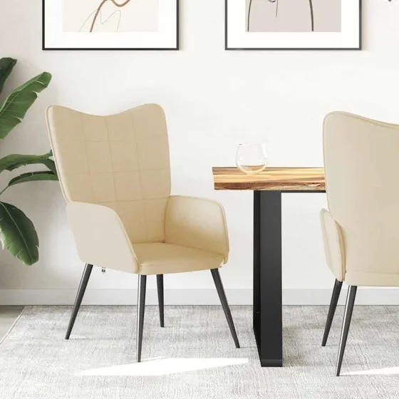 Cremefarvet lænestol i stof med stålstel og skumpolstring