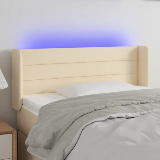 vidaXL sengegavl med LED-lys 83x16x78/88 cm stof cremefarvet