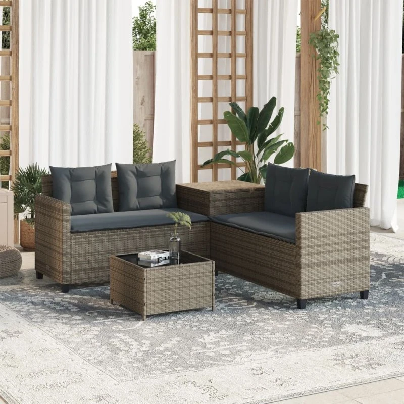 L-formet havesofa i grå polyrattan med bord og hynder