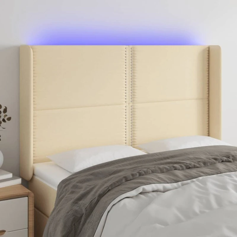 vidaXL sengegavl med LED-lys 147x16x118/128 cm stof cremefarvet